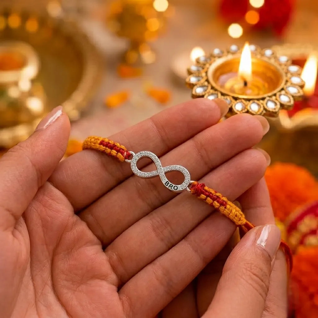 Marvel Silver infinity design rakhi for brother with yellow red braided thread and silver-tone stone-studded infinity charm