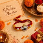 Marvel Silver Khatu Shyam Ji silver rakhi with premium designer silver charm, sparkling stone accents, and handcrafted red and yellow cotton thread for Raksha Bandhan.