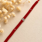 Marvel Silver minimal floral red thread rakhi for brother with silver-tone bead centre and accents