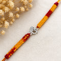 Marvel Silver Om design rakhi for brother with yellow red braided thread and silver-tone stone-studded charm