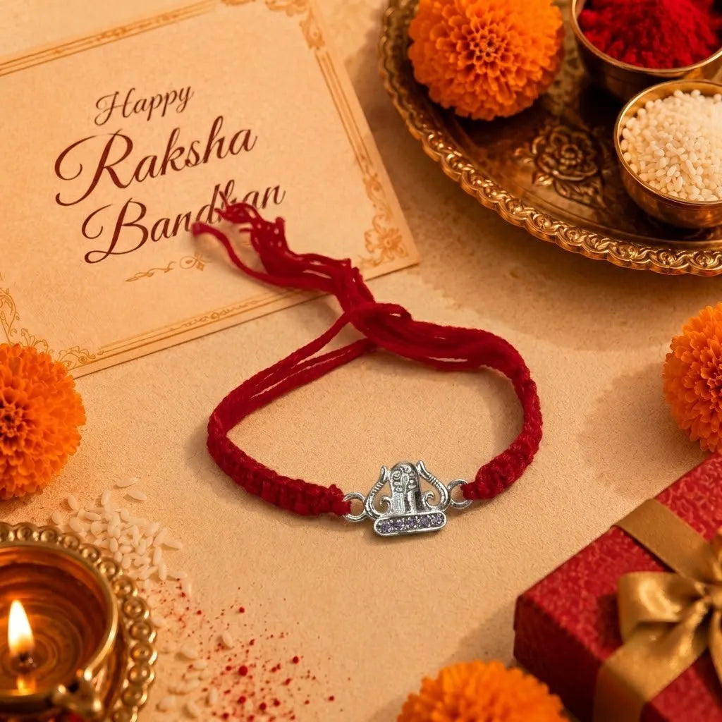 Marvel Silver Om Rakhi featuring a silver-finish Om symbol charm on a handcrafted red thread for Raksha Bandhan celebrations.