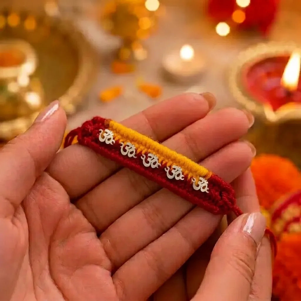 Silver Om Rakhi for Brother with Red & Yellow Thread
