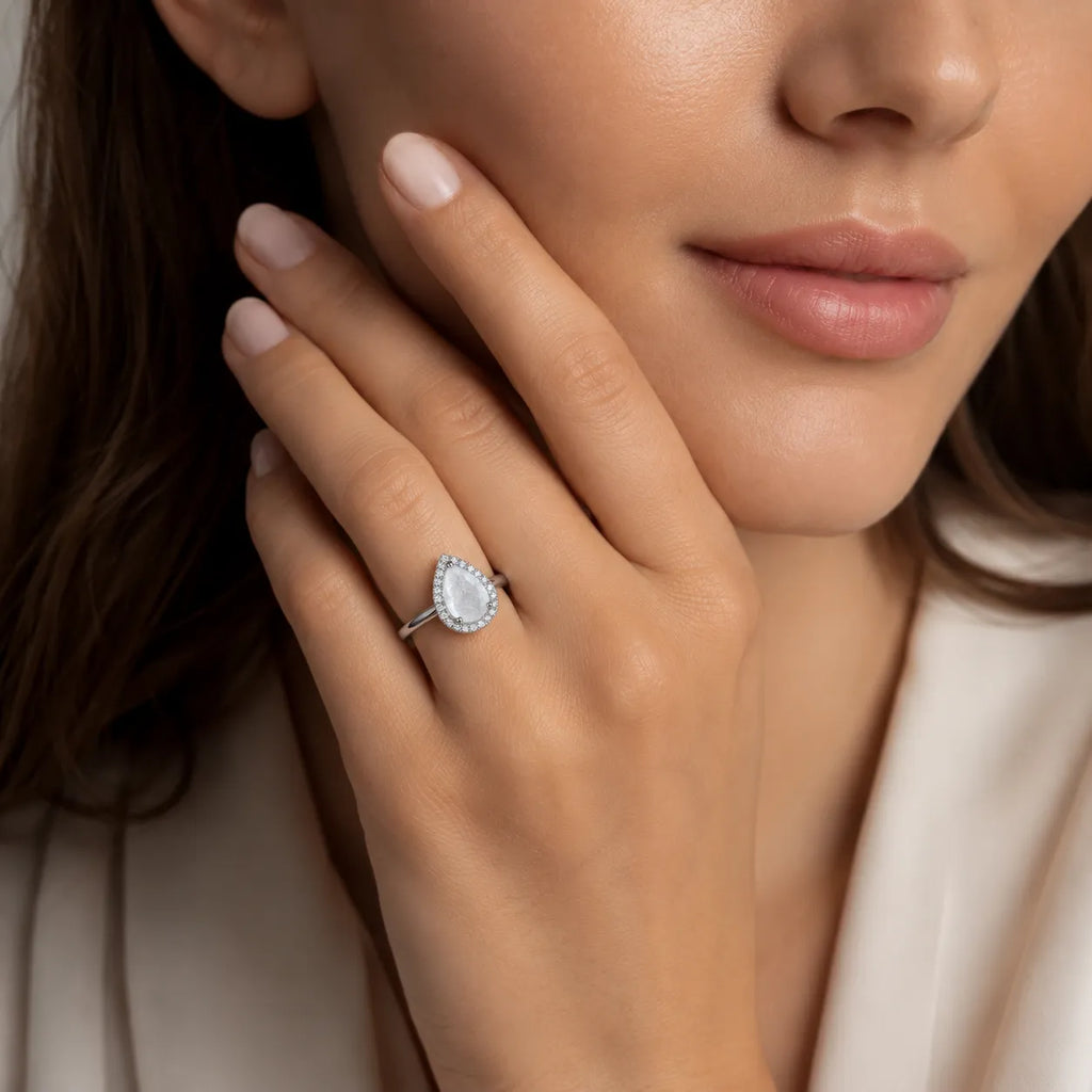 Marvel Silver pear shape white stone silver ring for women with sparkling halo design