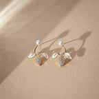 Marvel Silver pearl leaf designer imitation stud earrings with CZ stones, enamel leaves, and premium gold-plated finish for women.