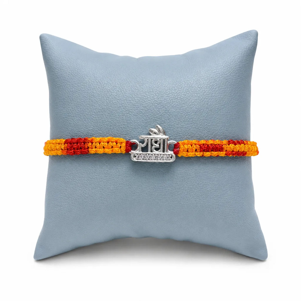 Marvel Silver Radha name rakhi for brother with yellow red braided thread and stone-studded silver-tone centre