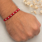 Marvel Silver red thread rakhi for brother with polished silver-tone round bead detailing