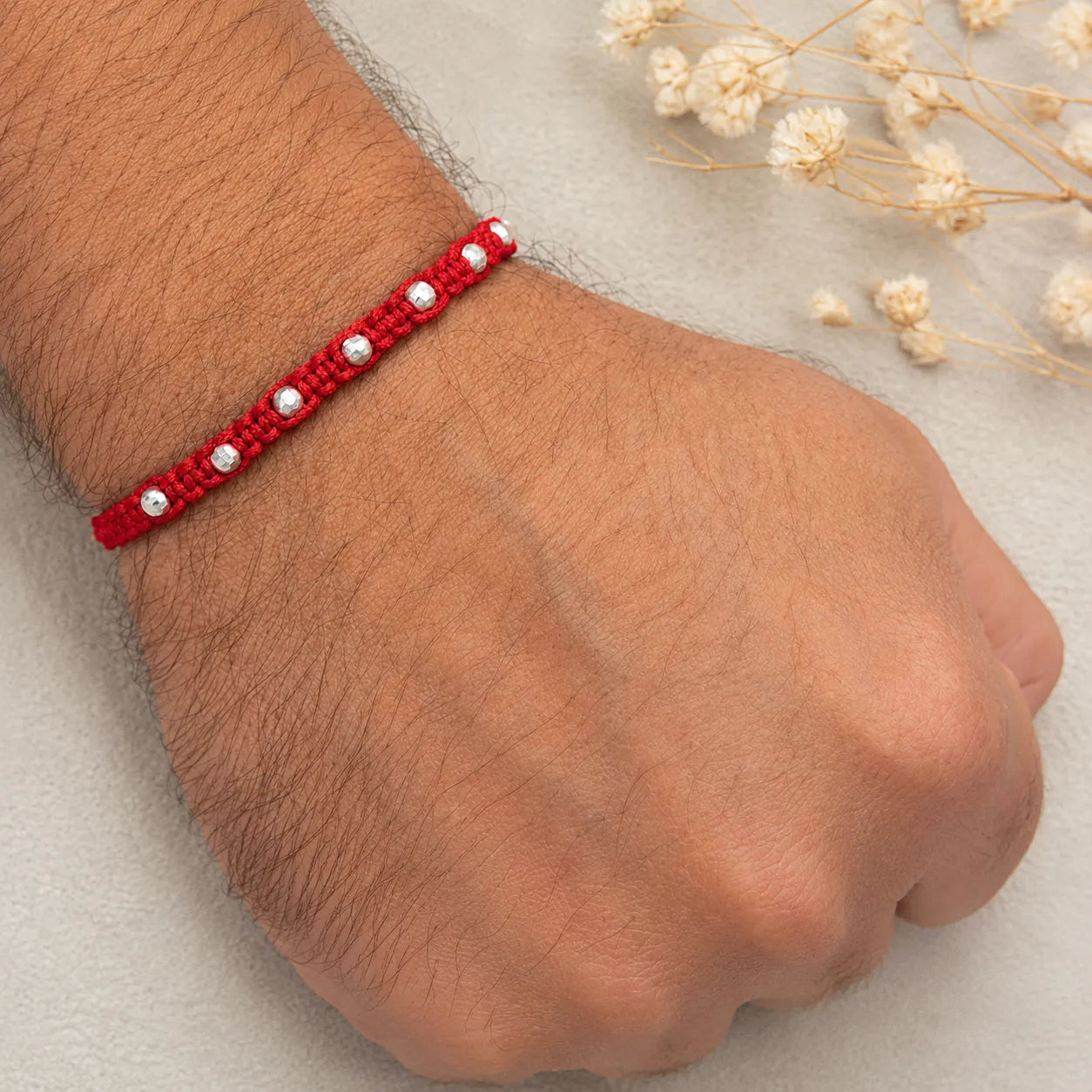 Marvel Silver red thread rakhi for brother with polished silver-tone round bead detailing