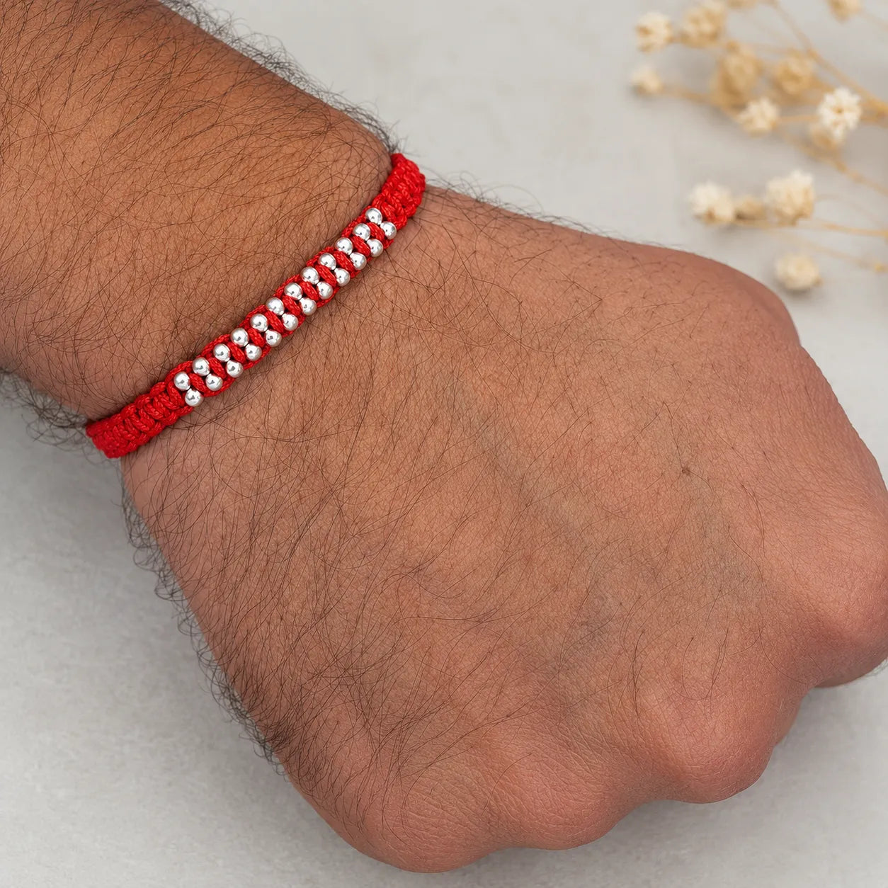 Marvel Silver red thread double bead rakhi for brother with polished silver-tone bead detailing