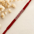 Marvel Silver red thread double bead rakhi for brother with polished silver-tone bead detailing