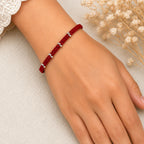 Marvel Silver red thread minimal rakhi with polished silver-tone bead cluster detailing