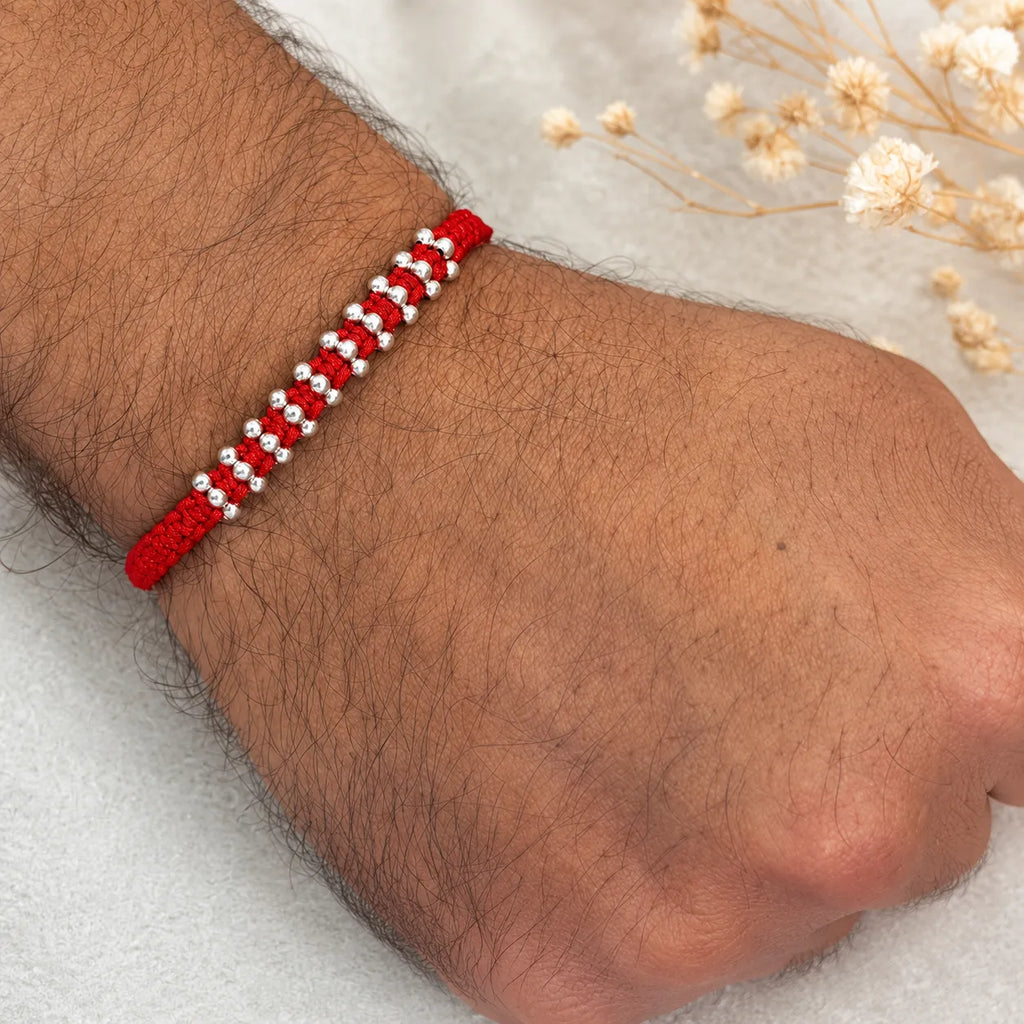 Marvel Silver red thread multi bead rakhi for brother with polished silver-tone bead cluster detailing