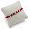 Marvel Silver red thread rakhi with clear stone floral centre and polished silver-tone bead detailing
