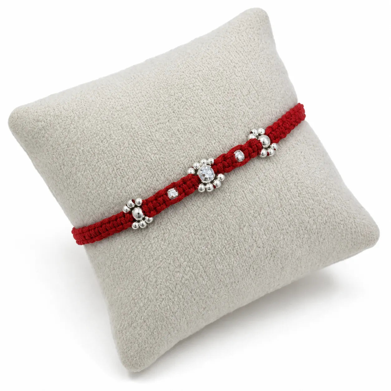 Marvel Silver red thread rakhi with clear stone floral centre and polished silver-tone bead detailing