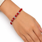 Marvel Silver red thread rakhi with clear stone floral centre and polished silver-tone bead detailing