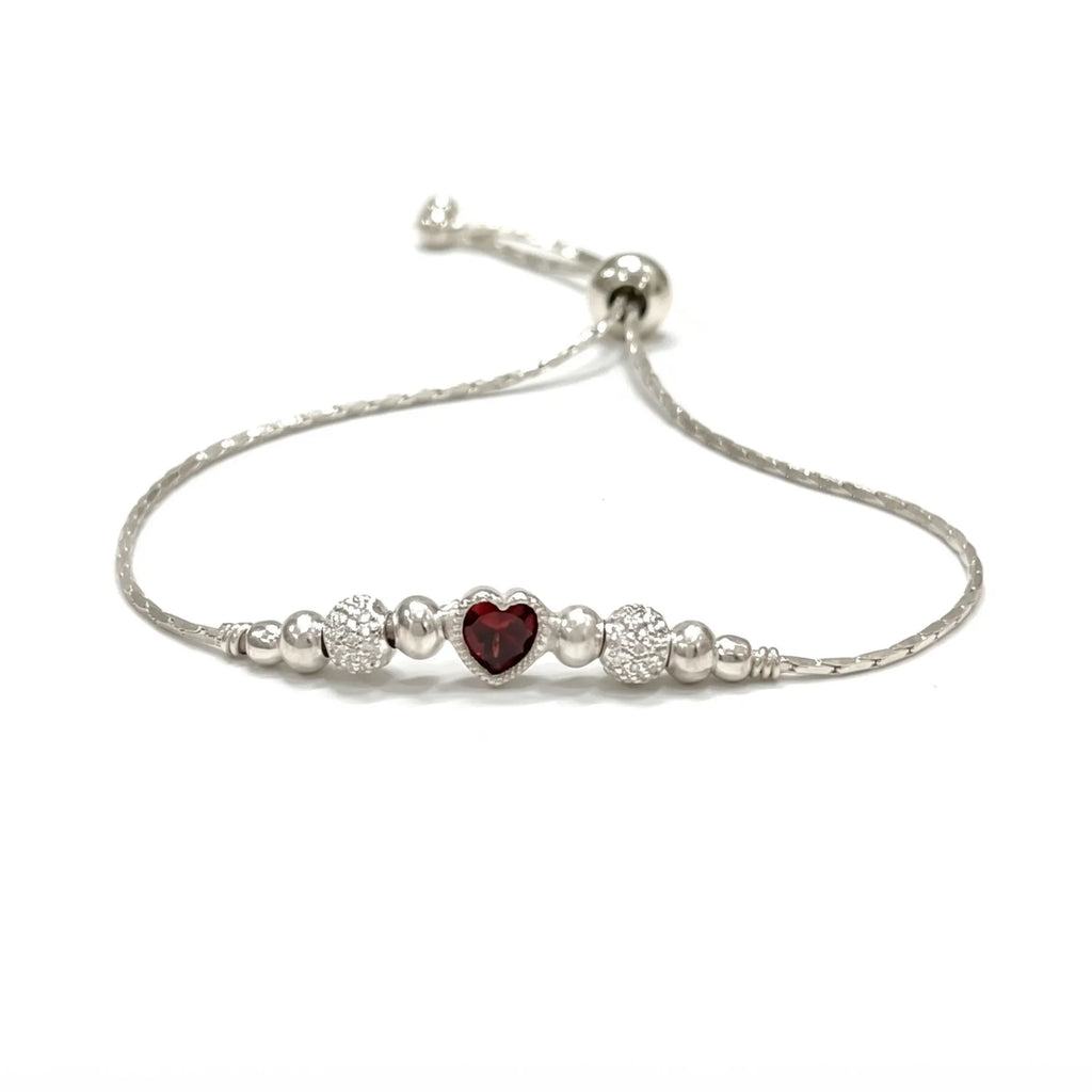 Marvel Silver Ruby Heart Bracelet with adjustable silver chain, ruby red heart crystal, polished silver beads, and sparkling crystal ball accents for women and girls.
