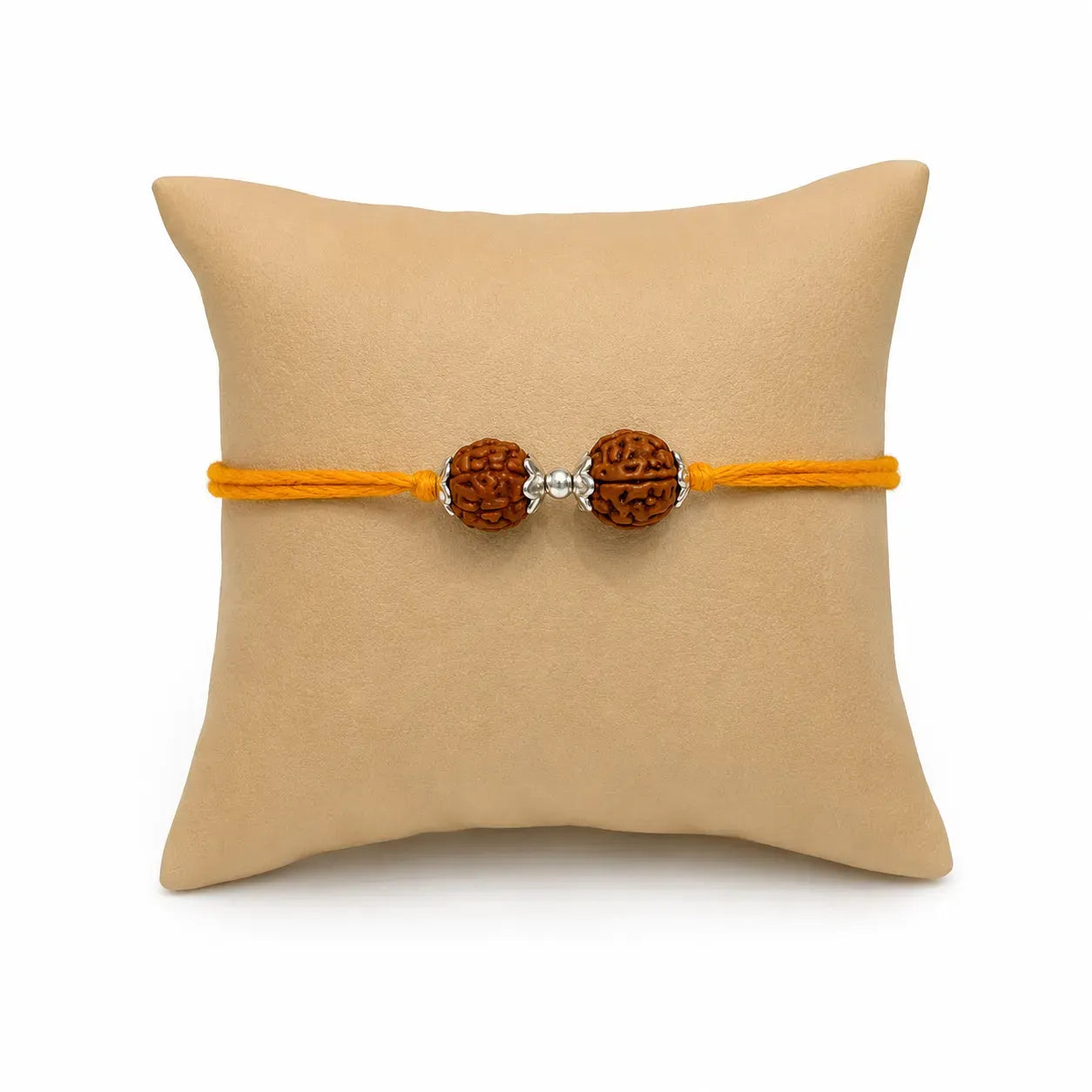 Marvel Silver Rudraksha Bead Designer Rakhi with two natural Rudraksha beads, polished silver spacer, and saffron thread for Raksha Bandhan.