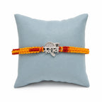 Marvel Silver Shiv name rakhi for brother with yellow red braided thread and silver-tone devotional centre motif