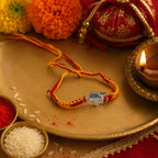 Marvel Silver Shiv name rakhi for brother with yellow red braided thread and silver-tone devotional centre motif
