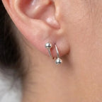 Marvel Silver 925 sterling silver spiral ball earrings featuring a modern open wrap design with polished silver ball accents for women and girls.