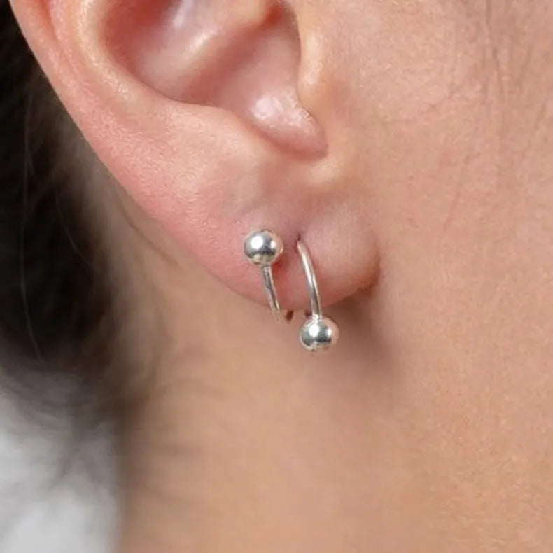 Marvel Silver 925 sterling silver spiral ball earrings featuring a modern open wrap design with polished silver ball accents for women and girls.
