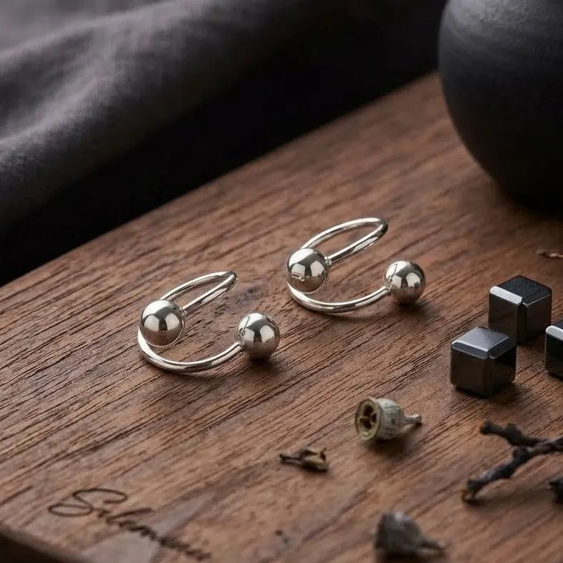 Marvel Silver 925 sterling silver spiral ball earrings featuring a modern open wrap design with polished silver ball accents for women and girls.