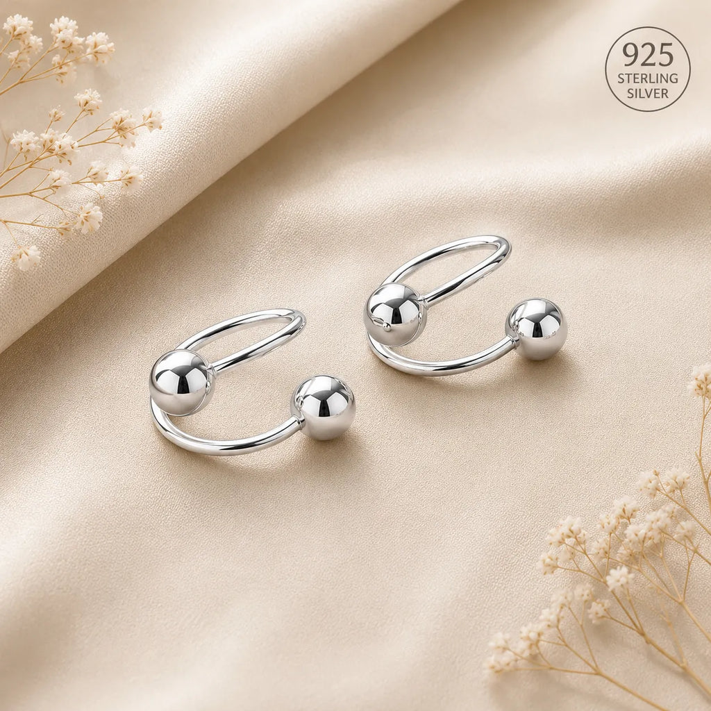 Marvel Silver 925 sterling silver spiral ball earrings featuring a modern open wrap design with polished silver ball accents for women and girls.