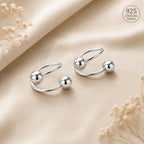 Marvel Silver 925 sterling silver spiral ball earrings featuring a modern open wrap design with polished silver ball accents for women and girls.