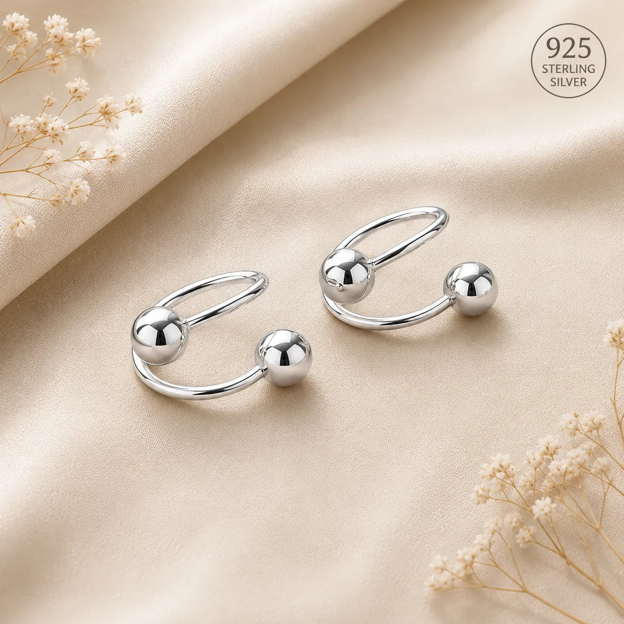 Marvel Silver 925 sterling silver spiral ball earrings featuring a modern open wrap design with polished silver ball accents for women and girls.