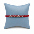 Marvel Silver square bead rakhi for brother with red braided thread, beige square beads and silver-tone accents