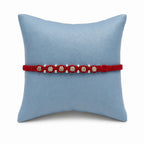 Marvel Silver square bead rakhi for brother with red braided thread, beige square beads and silver-tone accents