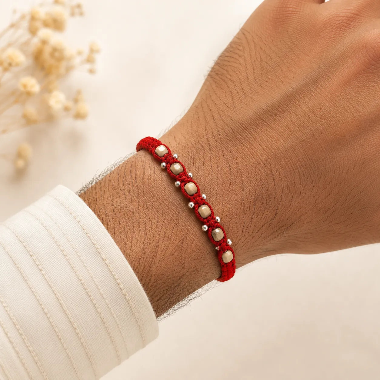 Marvel Silver square bead rakhi for brother with red braided thread, beige square beads and silver-tone accents