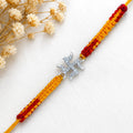 Marvel Silver Swastik design rakhi for brother with yellow red braided thread and stone-studded silver-tone charm
