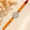 Marvel Silver Swastik motif rakhi for brother with yellow braided thread and silver-tone circular centre charm