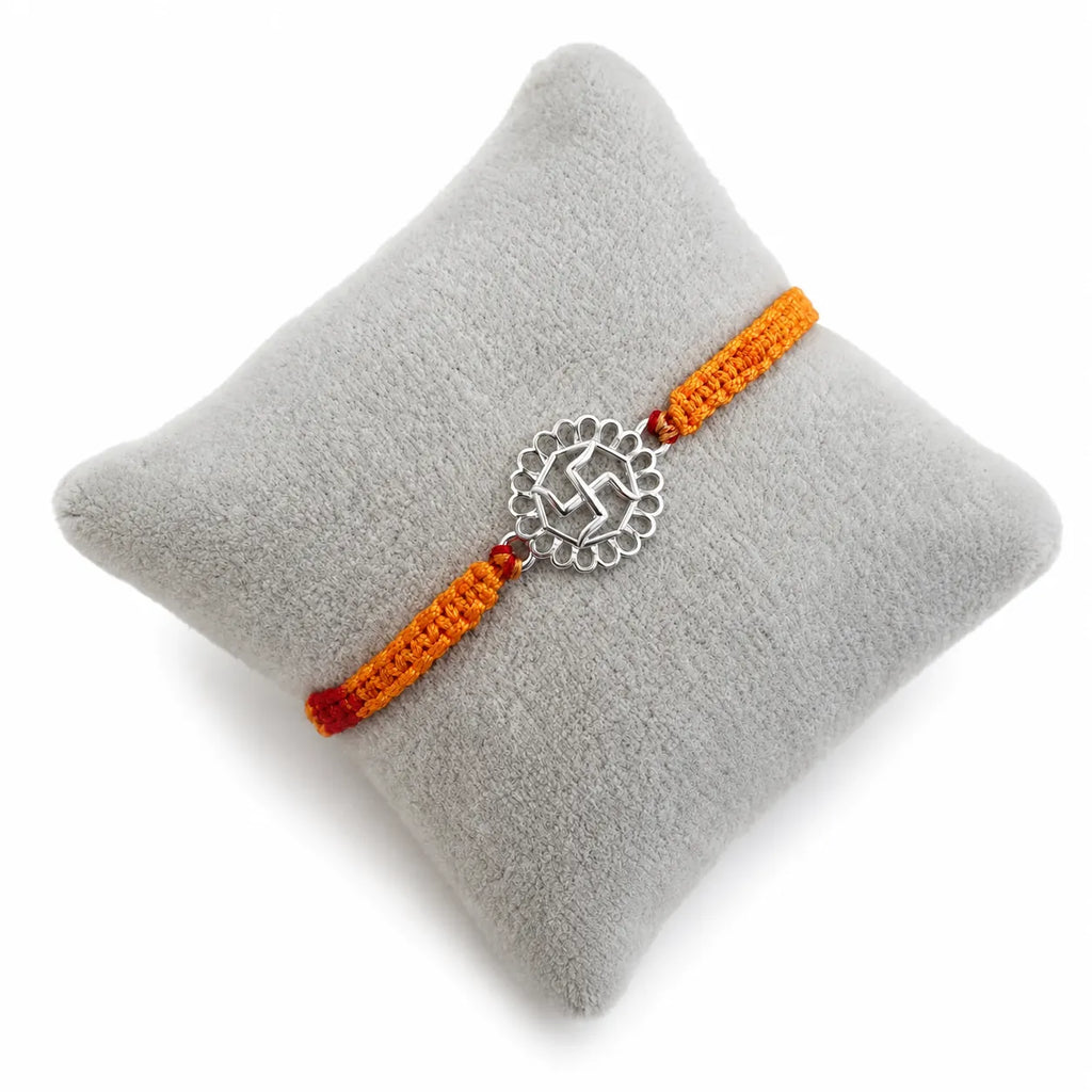 Marvel Silver Swastik motif rakhi for brother with yellow braided thread and silver-tone circular centre charm