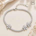 Marvel Silver 925 sterling silver tennis bracelet featuring three sparkling flower motifs with AAA Cubic Zirconia stones, adjustable chain, rhodium-plated finish, elegant bracelet for women and girls suitable for daily wear, parties, weddings, festive occasions, and gifting.