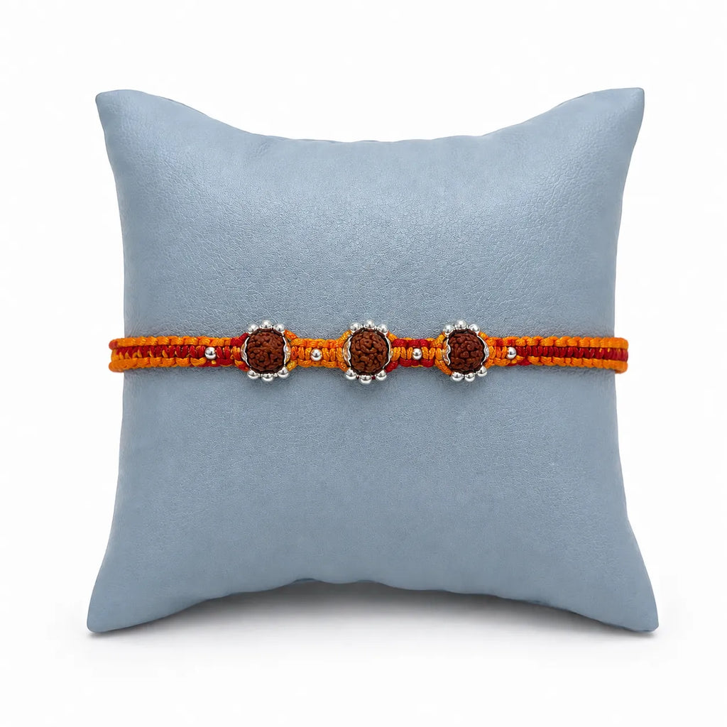 Marvel Silver triple Rudraksha rakhi for brother with red yellow braided thread and silver-tone bead accents