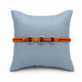 Marvel Silver triple Rudraksha rakhi for brother with red yellow braided thread and silver-tone bead accents