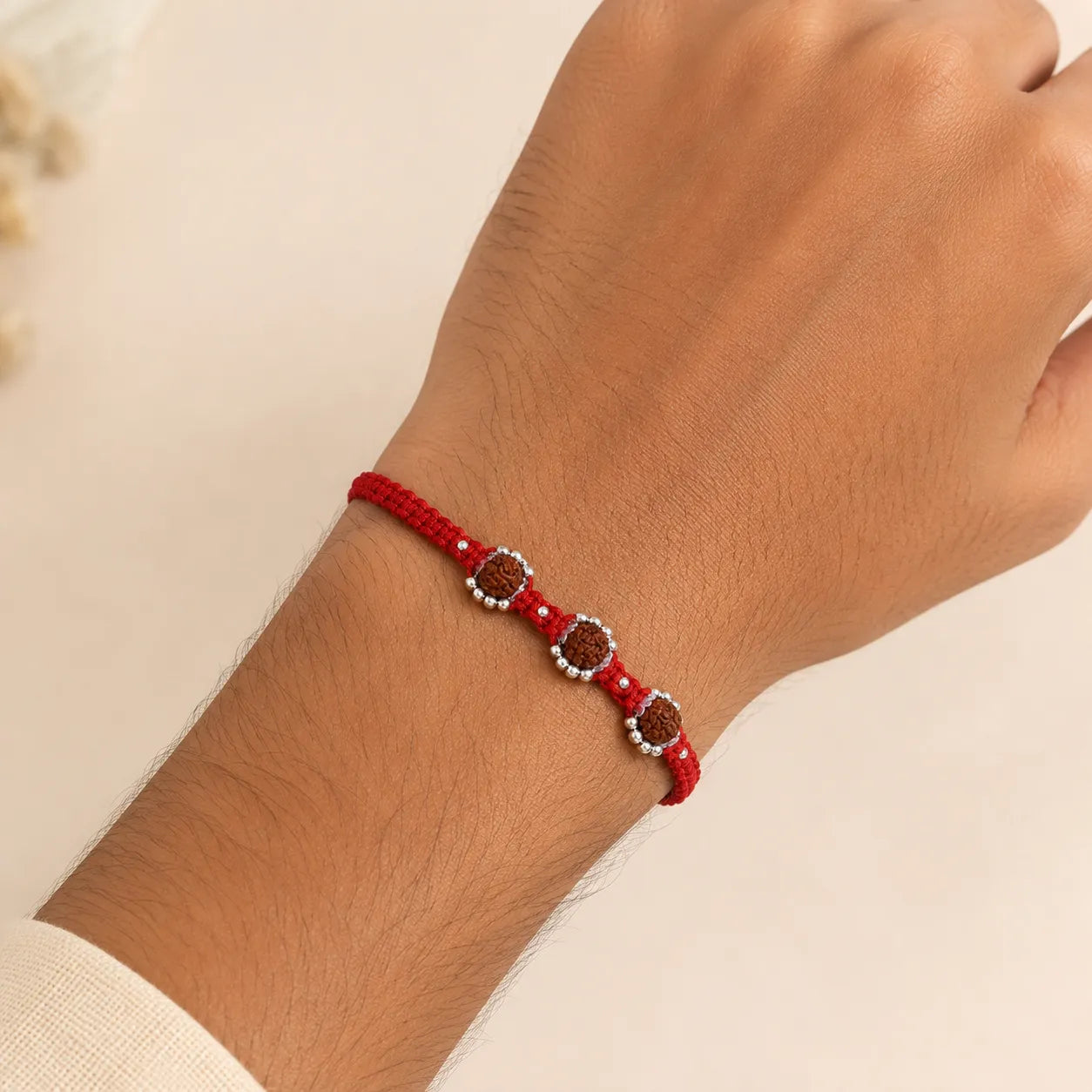 Marvel Silver triple Rudraksha red thread rakhi for brother with silver-tone bead accents