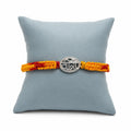Marvel Silver Veera rakhi for brother with yellow red braided thread and silver-tone name centre motif