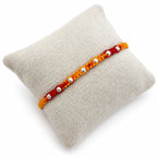 Marvel Silver yellow red bead rakhi for brother with polished silver-tone round bead detailing