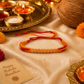 Marvel Silver yellow and red braided rakhi bracelet for men with silver-tone bead detailing