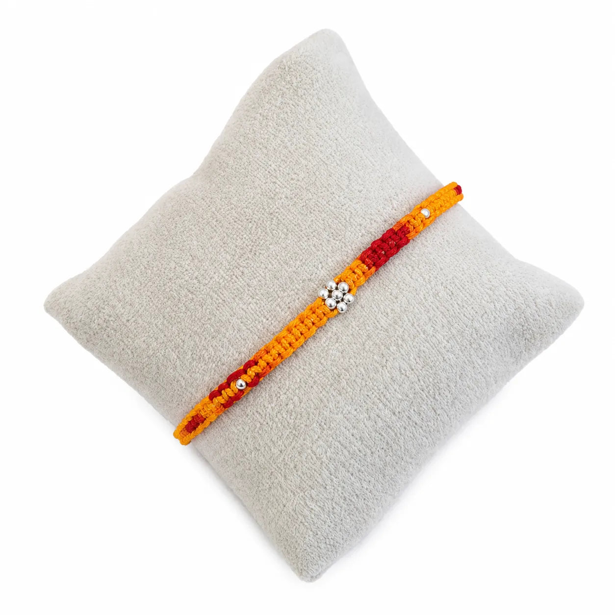 Marvel Silver yellow red floral bead rakhi for brother with polished silver-tone centre bead cluster