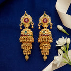 Triple layer imitation gold polish jhumka earrings with ruby red, green and white stone detailing by Marvel Silver