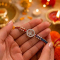 Marvel Silver Shiv Trishul Silver Rakhi with Sacred Red, Saffron and Blue Thread, Silver Beads and Sparkling Shiv Symbol for Raksha Bandhan