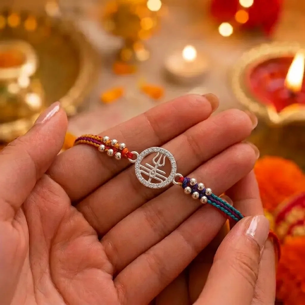 Marvel Silver Shiv Trishul Silver Rakhi with Sacred Red, Saffron and Blue Thread, Silver Beads and Sparkling Shiv Symbol for Raksha Bandhan