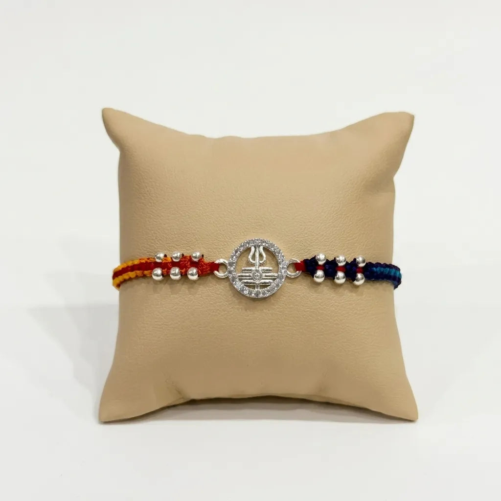 Marvel Silver Shiv Trishul Silver Rakhi with Sacred Red, Saffron and Blue Thread, Silver Beads and Sparkling Shiv Symbol for Raksha Bandhan