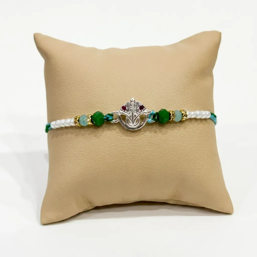 Marvel Silver Vishnu Tilak Silver Rakhi with Green Crystal Beads, White Pearl Beads and CZ Stone Vishnu Tilak Symbol for Raksha Bandhan
