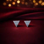 •Sophisticated triangular stud earrings densely paved with small, brilliant clear crystals.